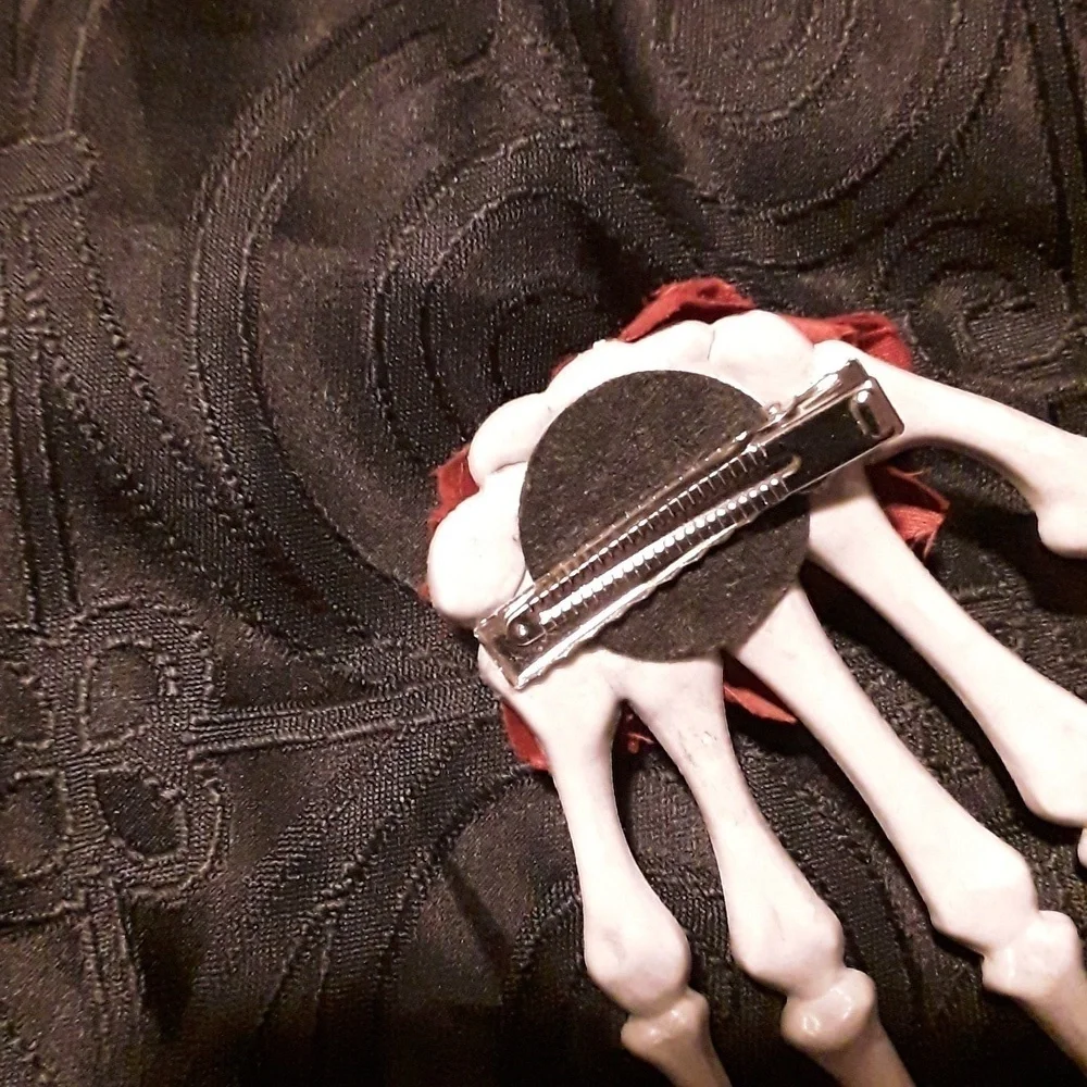 Skeleton hand rose hair clip